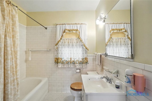 1452 Rollins Rd, Toledo, OH 43612 - full bathroom featuring tile walls, vanity, shower / tub combo with curtain, wainscoting, and tile patterned flooring