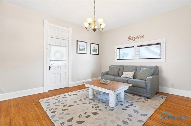 301 S High St, Pandora, OH 45877 - living area with a chandelier and wood finished floors