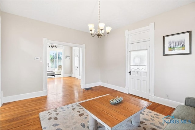 301 S High St, Pandora, OH 45877 - living room with a chandelier and wood finished floors