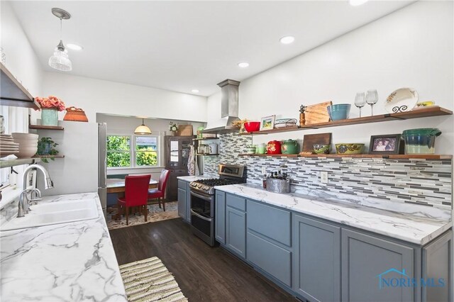 301 S High St, Pandora, OH 45877 - kitchen with double oven range, open shelves, wall chimney range hood, and recessed lighting