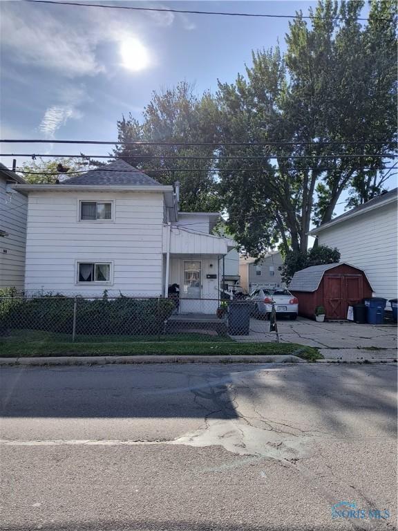 10 Edgewater, Toledo, OH 43611 - traditional home featuring a fenced front yard and a shed