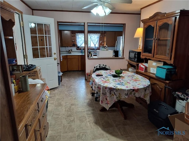 10 Edgewater, Toledo, OH 43611 - dining space with ornamental molding, ceiling fan, and stone finish floors