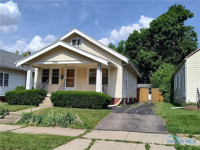 3906 Watson Ave, Toledo, OH 43612 - bungalow-style house featuring covered porch and asphalt driveway