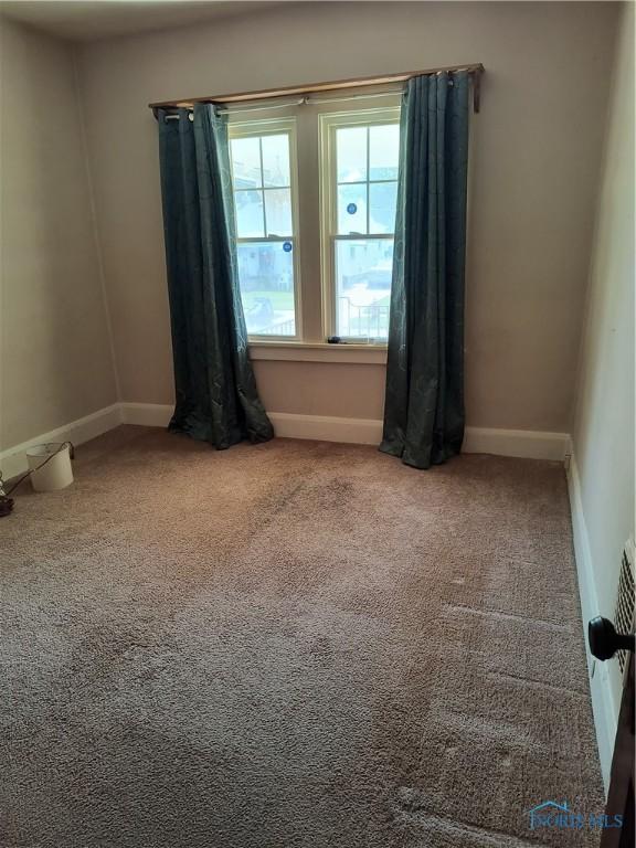 3906 Watson Ave, Toledo, OH 43612 - carpeted empty room with baseboards