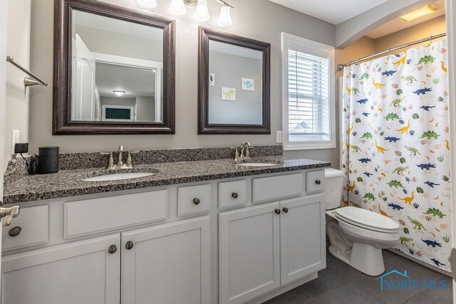 5539 Harris Hawk Ln, Sylvania, OH 43560 - full bath featuring double vanity, tile patterned floors, and a shower with shower curtain