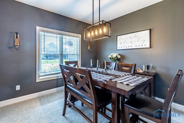 5539 Harris Hawk Ln, Sylvania, OH 43560 - dining area with carpet floors and a chandelier