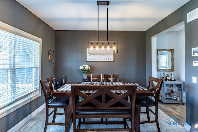 5539 Harris Hawk Ln, Sylvania, OH 43560 - dining area with baseboards and wood finished floors