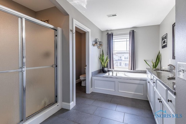 5539 Harris Hawk Ln, Sylvania, OH 43560 - full bathroom featuring a stall shower, vanity, a bath, and tile patterned floors