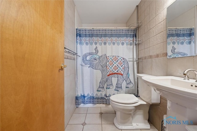 17918 Dunbridge Rd, Bowling Green, OH 43402 - bathroom featuring tile walls, tile patterned floors, and a shower with curtain