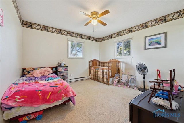 17918 Dunbridge Rd, Bowling Green, OH 43402 - bedroom featuring a baseboard heating unit, multiple windows, carpet, and a ceiling fan