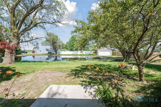 17918 Dunbridge Rd, Bowling Green, OH 43402 - view of yard featuring a water view, a garage, and an outdoor structure