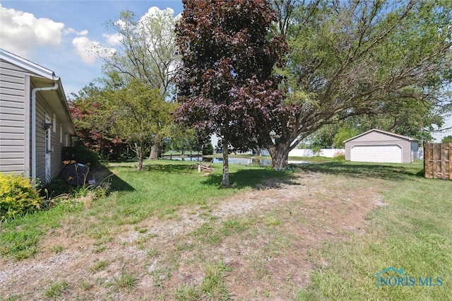 17918 Dunbridge Rd, Bowling Green, OH 43402 - view of yard featuring an outbuilding and a detached garage