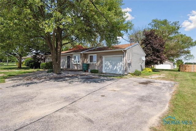 17918 Dunbridge Rd, Bowling Green, OH 43402 - single story home with an attached garage and a front lawn