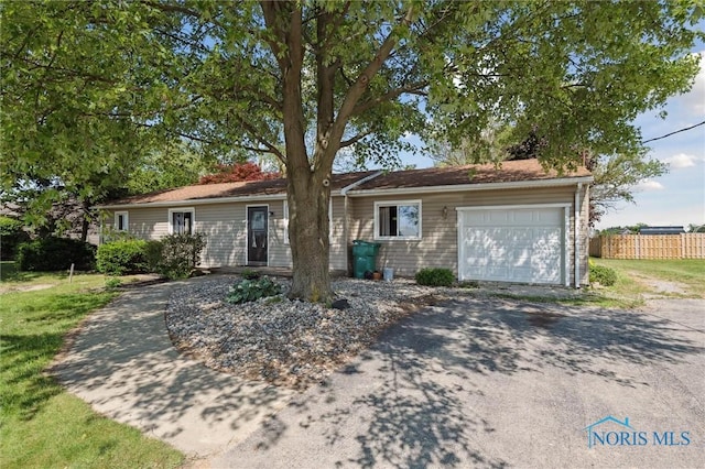 17918 Dunbridge Rd, Bowling Green, OH 43402 - ranch-style home with a garage and asphalt driveway