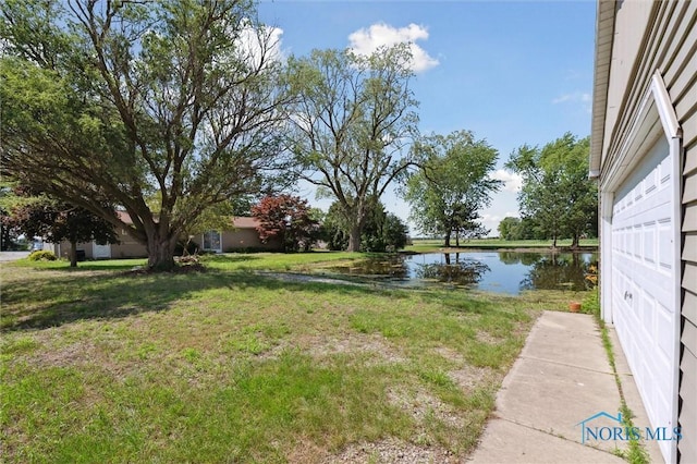 17918 Dunbridge Rd, Bowling Green, OH 43402 - view of green lawn with a water view