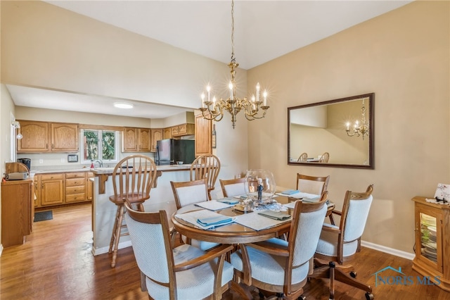 625 W Lake Ct Unit U5, Findlay, OH 45840 - dining area with a chandelier and wood finished floors