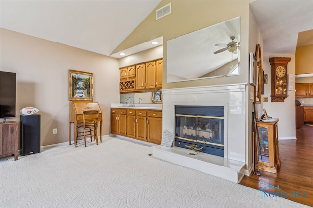 625 W Lake Ct Unit U5, Findlay, OH 45840 - living room featuring ceiling fan, a glass covered fireplace, light wood-style floors, high vaulted ceiling, and recessed lighting