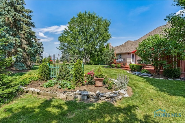 625 W Lake Ct Unit U5, Findlay, OH 45840 - view of grassy yard with a deck