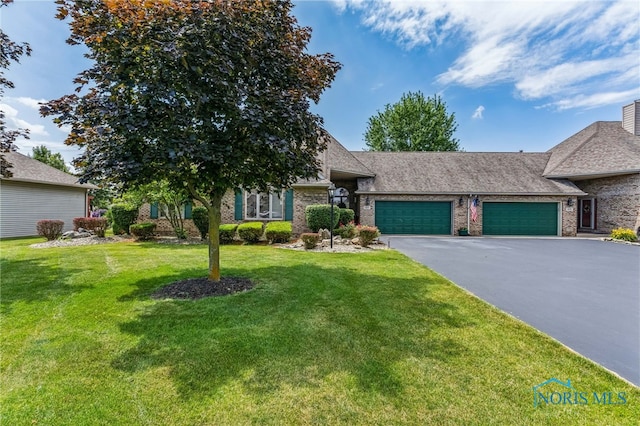 625 W Lake Ct Unit U5, Findlay, OH 45840 - view of front facade featuring a garage, driveway, brick siding, a front yard, and a shingled roof
