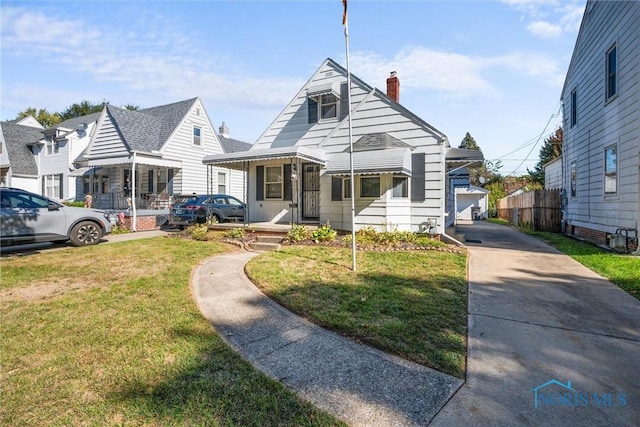 721 Colima Dr, Toledo, OH 43609 - bungalow-style home featuring a chimney and a front lawn