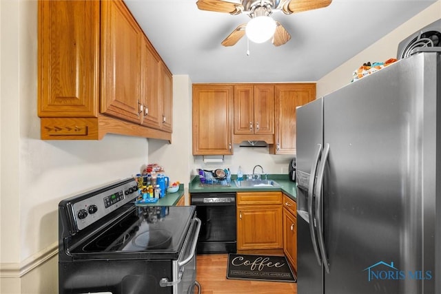 721 Colima Dr, Toledo, OH 43609 - kitchen with appliances with stainless steel finishes, a ceiling fan, brown cabinetry, and light wood-style flooring
