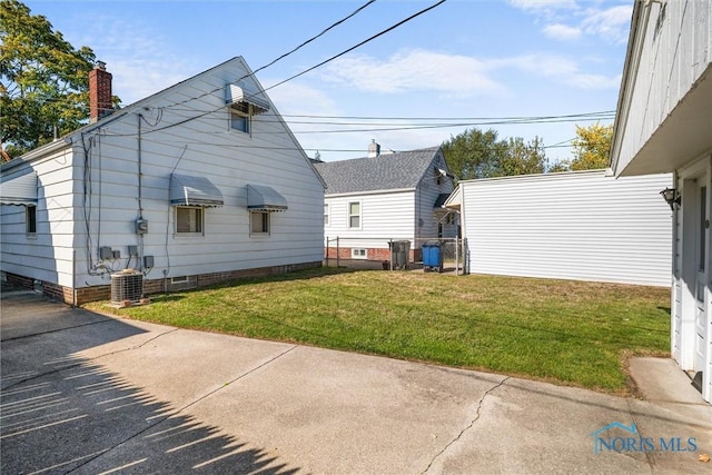 721 Colima Dr, Toledo, OH 43609 - rear view of property with a yard and a chimney