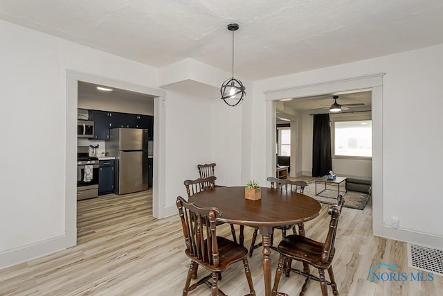 3947 Burnham Ave, Toledo, OH 43612 - dining space with light wood-style floors and ceiling fan