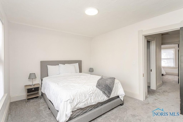 3947 Burnham Ave, Toledo, OH 43612 - bedroom featuring light carpet and baseboards