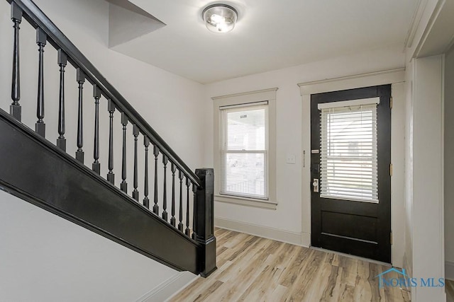 3947 Burnham Ave, Toledo, OH 43612 - foyer with stairs, light wood-style floors, and plenty of natural light