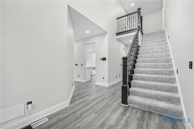 9414 Sheffield Rd, Perrysburg, OH 43551 - stairway with wood finished floors and recessed lighting