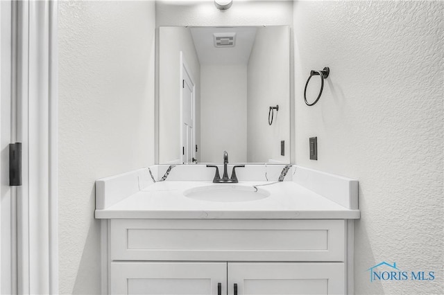 9414 Sheffield Rd, Perrysburg, OH 43551 - bathroom with a textured wall and vanity