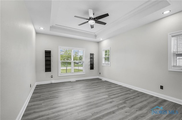 9414 Sheffield Rd, Perrysburg, OH 43551 - empty room featuring a tray ceiling, a ceiling fan, wood finished floors, and recessed lighting