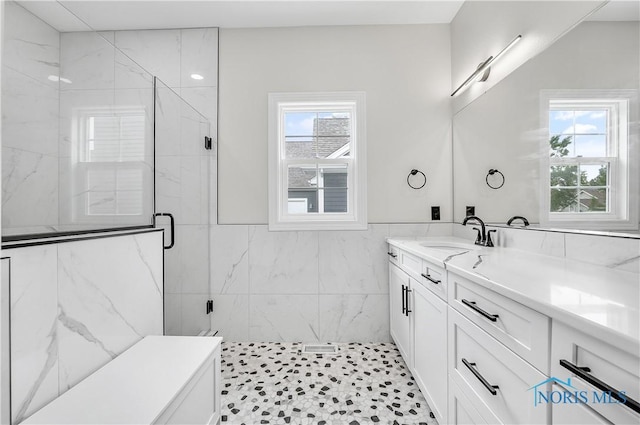 9414 Sheffield Rd, Perrysburg, OH 43551 - full bathroom featuring tile walls, healthy amount of natural light, vanity, a marble finish shower, and a wainscoted wall