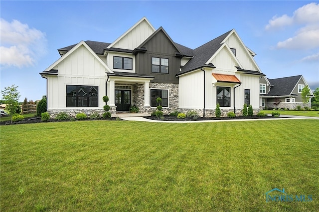 4214 Thornbury Ct, Perrysburg, OH 43551 - modern farmhouse style home featuring board and batten siding, a standing seam roof, and a front yard