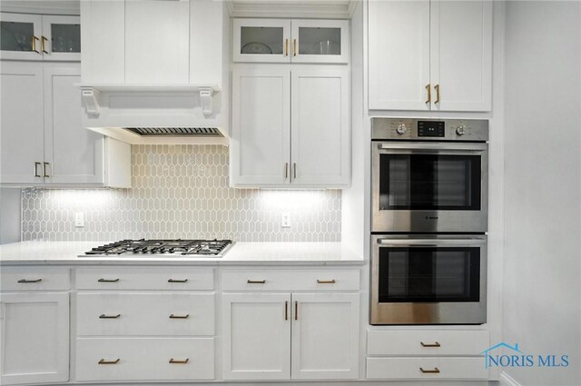 4214 Thornbury Ct, Perrysburg, OH 43551 - kitchen featuring appliances with stainless steel finishes, light countertops, tasteful backsplash, and white cabinets