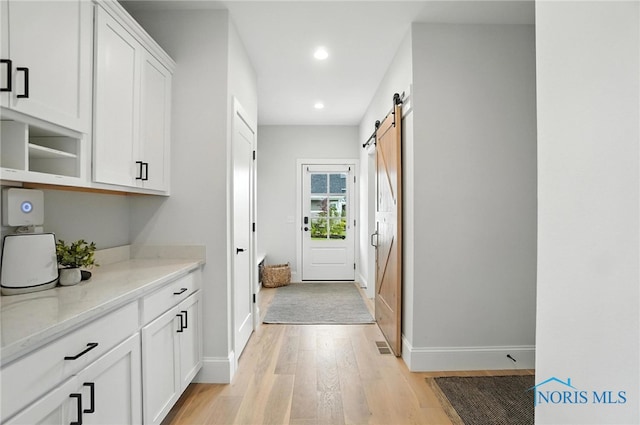 4214 Thornbury Ct, Perrysburg, OH 43551 - entryway with light wood-type flooring, recessed lighting, and a barn door