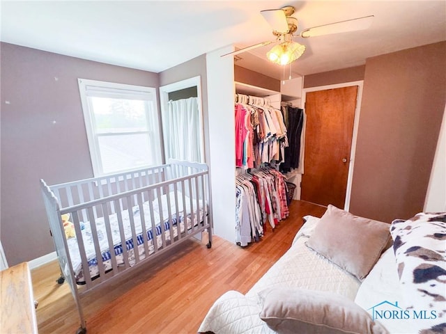 1925 Harlan Rd, Toledo, OH 43615 - bedroom featuring wood finished floors, ceiling fan, and a closet