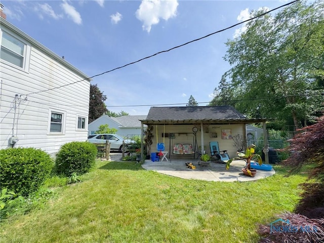 1925 Harlan Rd, Toledo, OH 43615 - back of property featuring a lawn and a patio