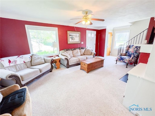 1925 Harlan Rd, Toledo, OH 43615 - carpeted living room with a ceiling fan and stairs