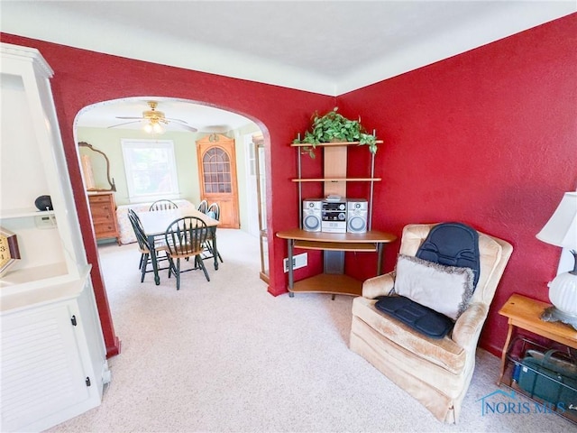 1925 Harlan Rd, Toledo, OH 43615 - sitting room with arched walkways, carpet flooring, and a ceiling fan