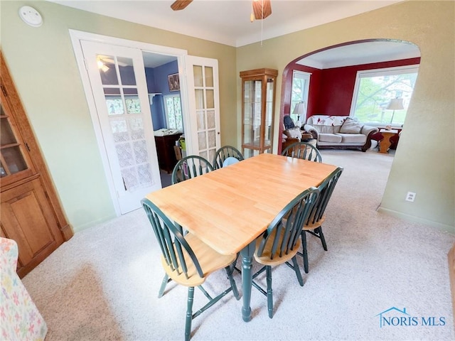 1925 Harlan Rd, Toledo, OH 43615 - carpeted dining space featuring arched walkways and ceiling fan
