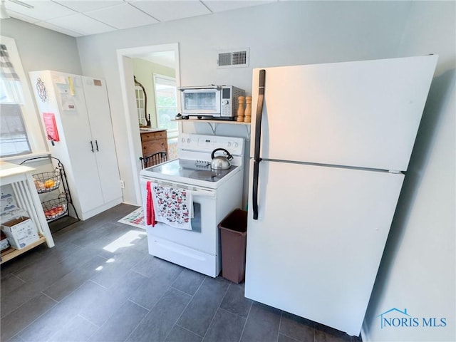 1925 Harlan Rd, Toledo, OH 43615 - kitchen with white appliances and a drop ceiling