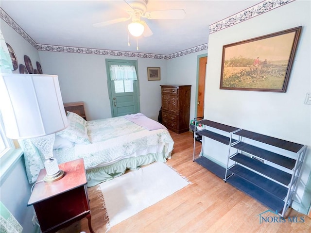 1925 Harlan Rd, Toledo, OH 43615 - bedroom featuring light wood-style flooring and a ceiling fan