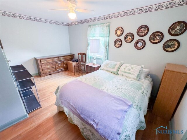 1925 Harlan Rd, Toledo, OH 43615 - bedroom featuring light wood-type flooring and a ceiling fan