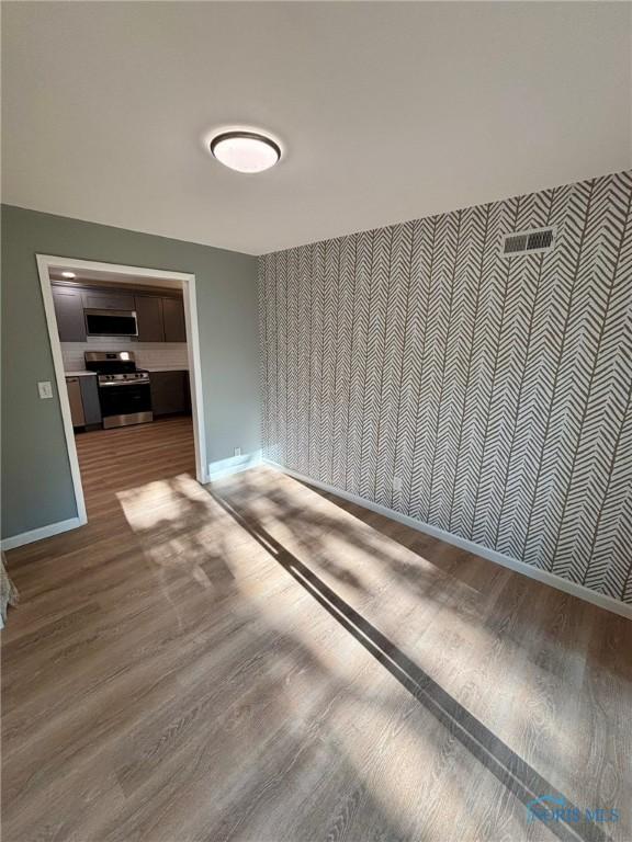 1948 Sudbury Dr, Holland, OH 43528 - spare room with wood finished floors