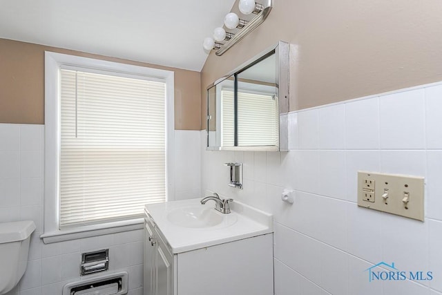 1831 Evansdale Ave, Toledo, OH 43607 - half bathroom with tile walls, vanity, and wainscoting