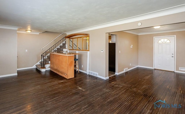 1831 Evansdale Ave, Toledo, OH 43607 - bar with hardwood / wood-style floors, stairway, arched walkways, and ornamental molding