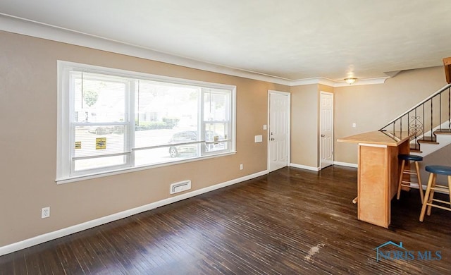 1831 Evansdale Ave, Toledo, OH 43607 - entrance foyer featuring dark wood-type flooring, stairs, and crown molding