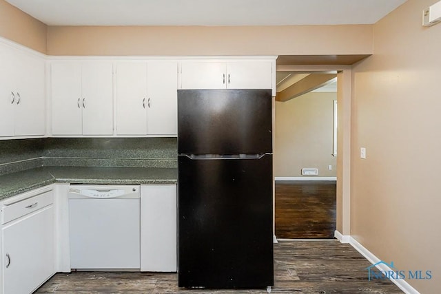 1831 Evansdale Ave, Toledo, OH 43607 - kitchen featuring freestanding refrigerator, dishwasher, dark wood finished floors, and white cabinetry