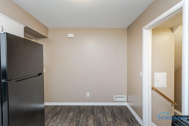 1831 Evansdale Ave, Toledo, OH 43607 - kitchen featuring freestanding refrigerator, dark wood-style floors, and white cabinetry